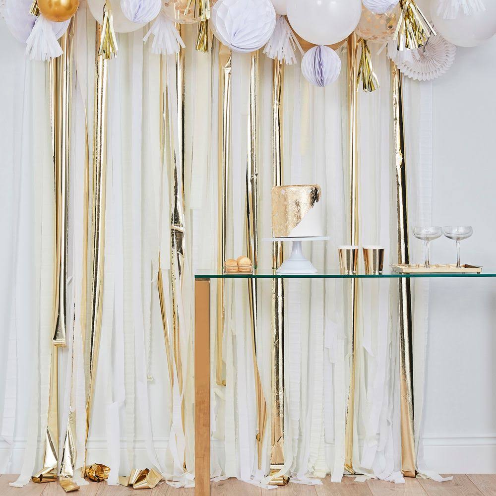 How to Make a DIY Streamer Backdrop from 99 Cent Streamers - Pop of Gold